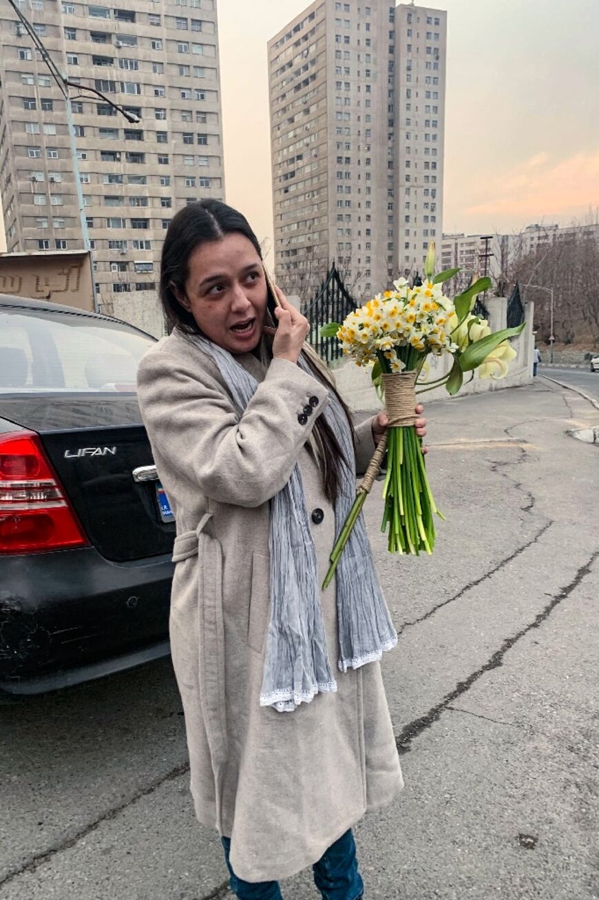 She walked free from Tehran's Evin prison clutching flowers and notably not wearing the Islamic headscarf, in apparent defiance of Iran's strict dress laws