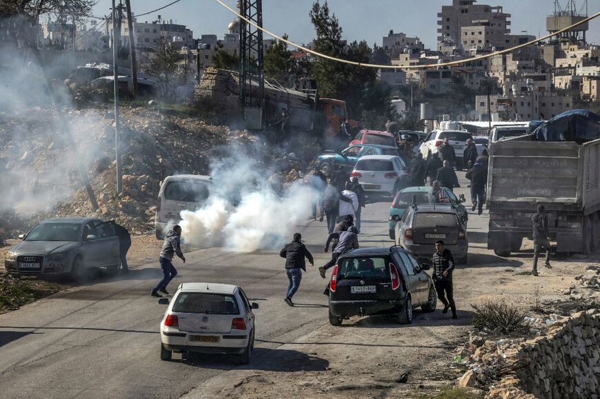 Tear gas is fired by Israeli forces in the village of Halhul  in the occupied West Bank after Palestinian Hamdi Abu Dayyeh  was shot dead