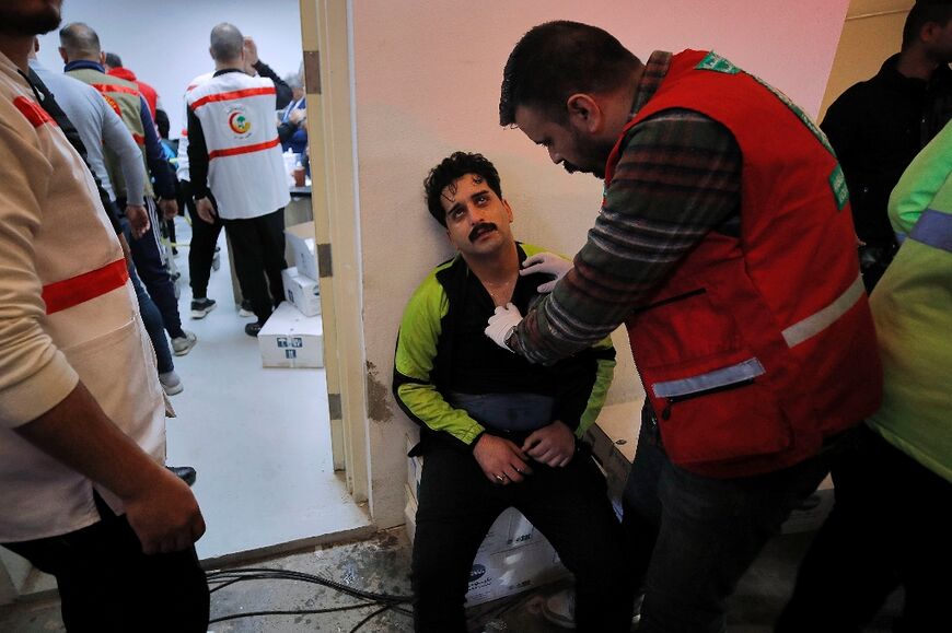 An injured fan is examined in an emergency area at the stadium