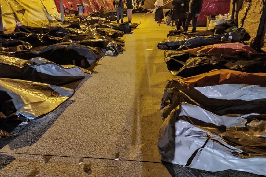 AFP journalists counted nearly 200 bodies, arranged on either side of tents, on Wednesday evening