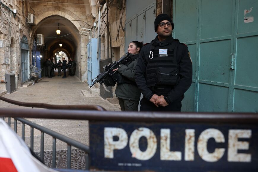 Israeli police stand guard in Jerusalem's Old City following a reported stabbing attack on February 13 
