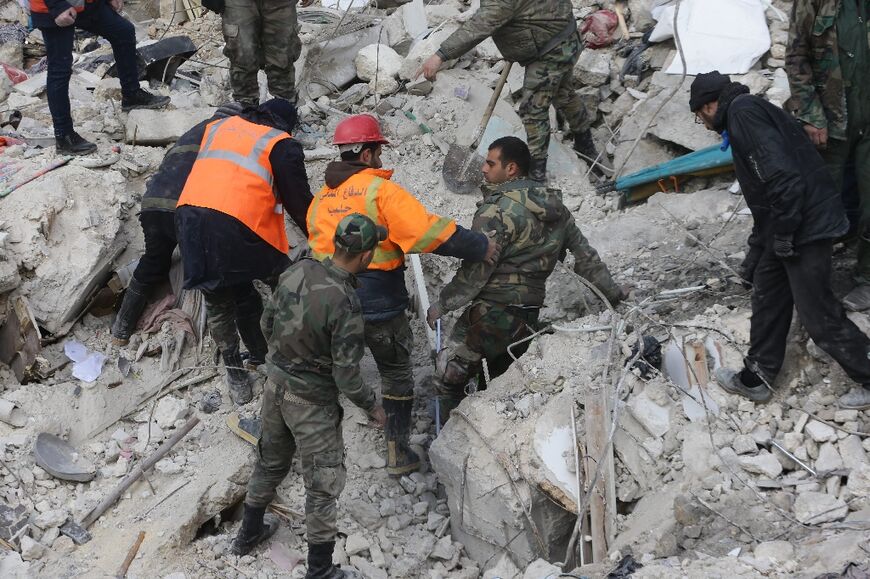 Soldiers, rescuers and Aleppo residents used pickaxes and shovels to free survivors trapped under the debris