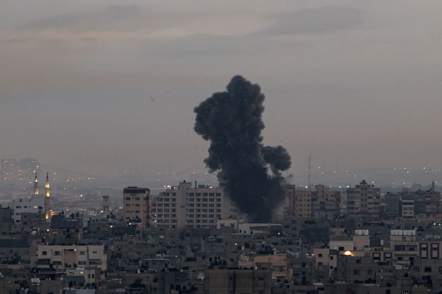 Smoke rises above buildings in Gaza City as Israel launched air strikes early on February 23, 2023