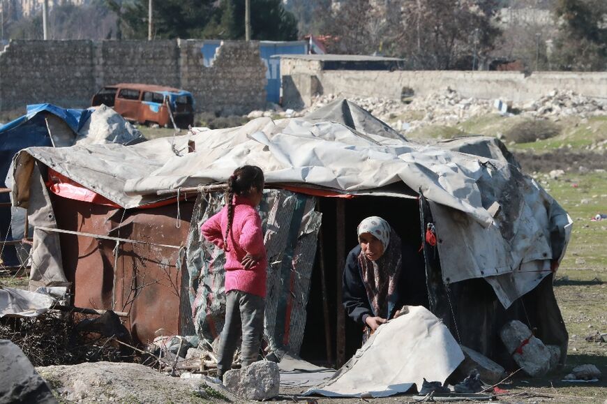 Syrians displaced by the quake disaster at a makeshift camp in the government-held northern city of Aleppo 