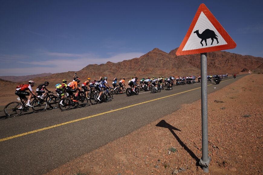 The riders contend with fierce winds, a sandstorm and the threat of camels and donkeys crossing the road