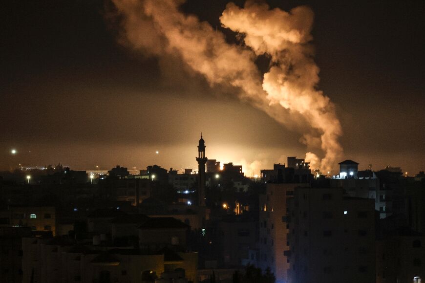 Fire and smoke rise above Gaza City after Israel launched air strikes on a Hamas facility in the Palestinian enclave early on February 13, 2023