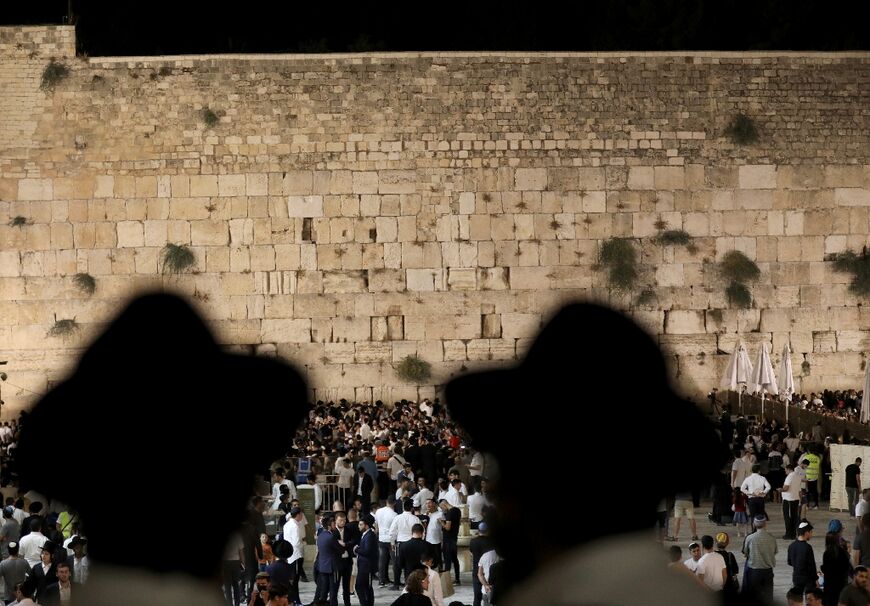 Orthodox Jewish men pray at the Western Wall in Jerusalem's Old City on July 17, 2021: it marks the holiest site where Jews can pray