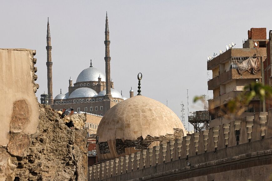 Cairo's iconic domes and minarets are embedded into the labyrinthine alleys of tight-knit working-class neighbourhoods