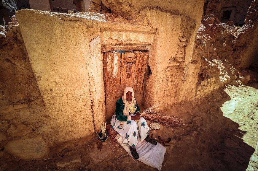 A woman sits in an alley in the Jewish qaurter of Tagadirt: dating back to antiquity, the Jewish community in Morocco reached its peak in the 15th century, following the brutal expulsion of Sephardic Jews from Spain