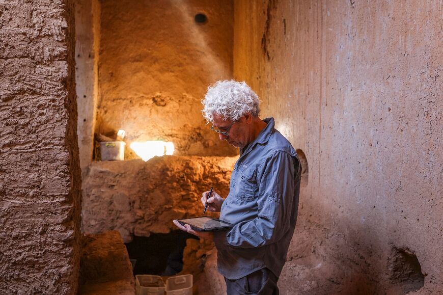An archaeologist works in the ruins of a synagogue Morocco's Akka oasis, part of project to revive the North African country's Jewish heritage 