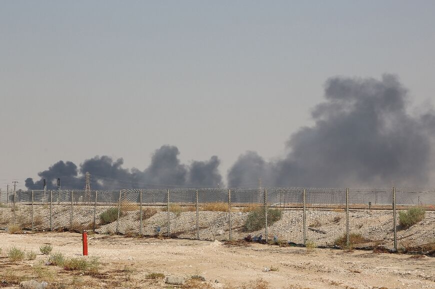 Smoke billows from a Saudi oil facility on September 14, 2019 after an attack claimed by Yemen's Iran-aligned Huthi rebels 