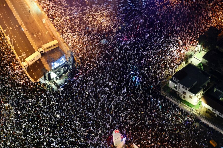 Tens of thousands of Israelis throng the heart of Tel Aviv for a 12th straight week of protests against the hard-right government's controversial judicial reforms