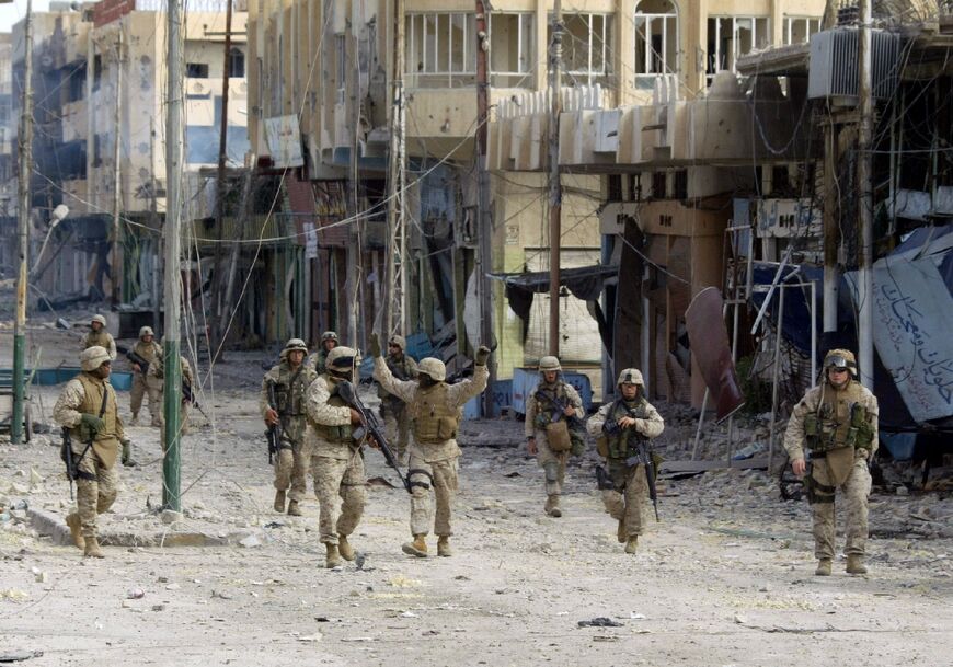 US Marines from the 3/5 Lima Company are seen after taking a key bridge in the restive city of Fallujah, in this file photo from November 24, 2005 