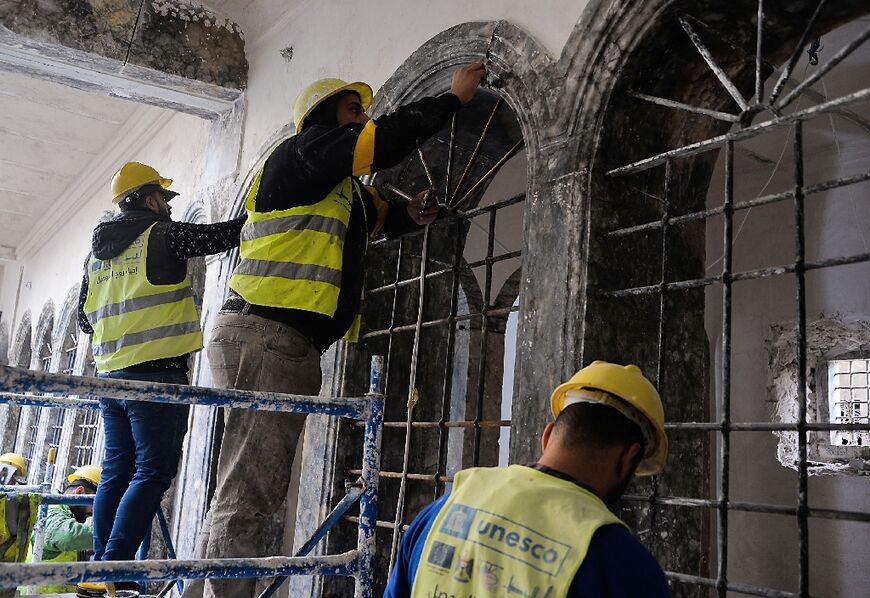 A UNESCO team works on a restoration in the Old City of Mosul, Iraq