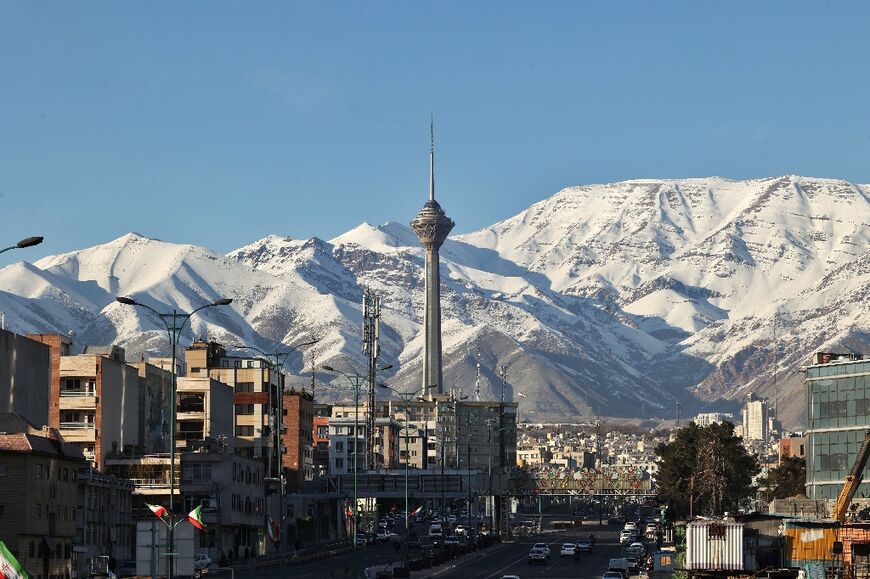 Downtown Tehran's before snow-covered mountains