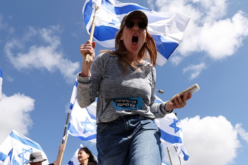 A woman protests against the Israeli government's controversial judicial reform bill in Haifa