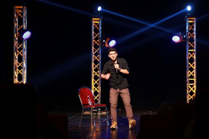 Yusef Bataineh, a graduate of the Amman Comedy Club, performs on stage at Al-Shams theatre