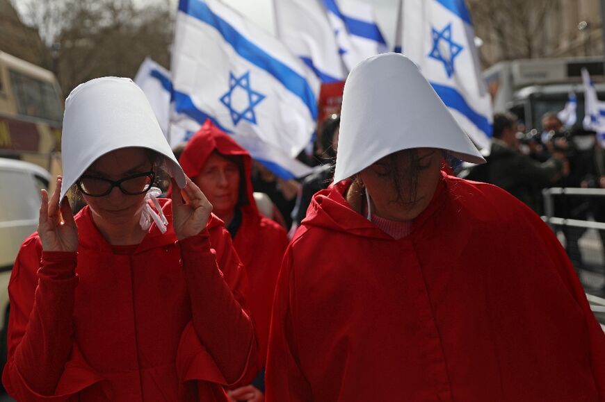 Protesters supporting women's rights, dressed as characters from The Handmaid's Tale 