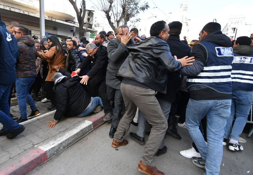 The demonstrators defied a ban imposed by Tunis authorities and charged police barricades