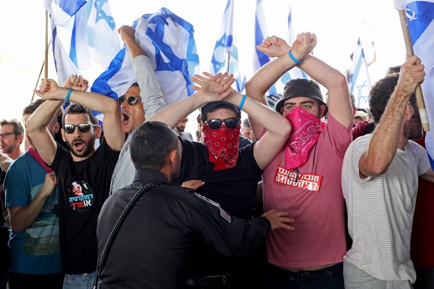 Demonstrators, carrying Israeli flags, rallies against the reforms that would give politicains more power over the courts