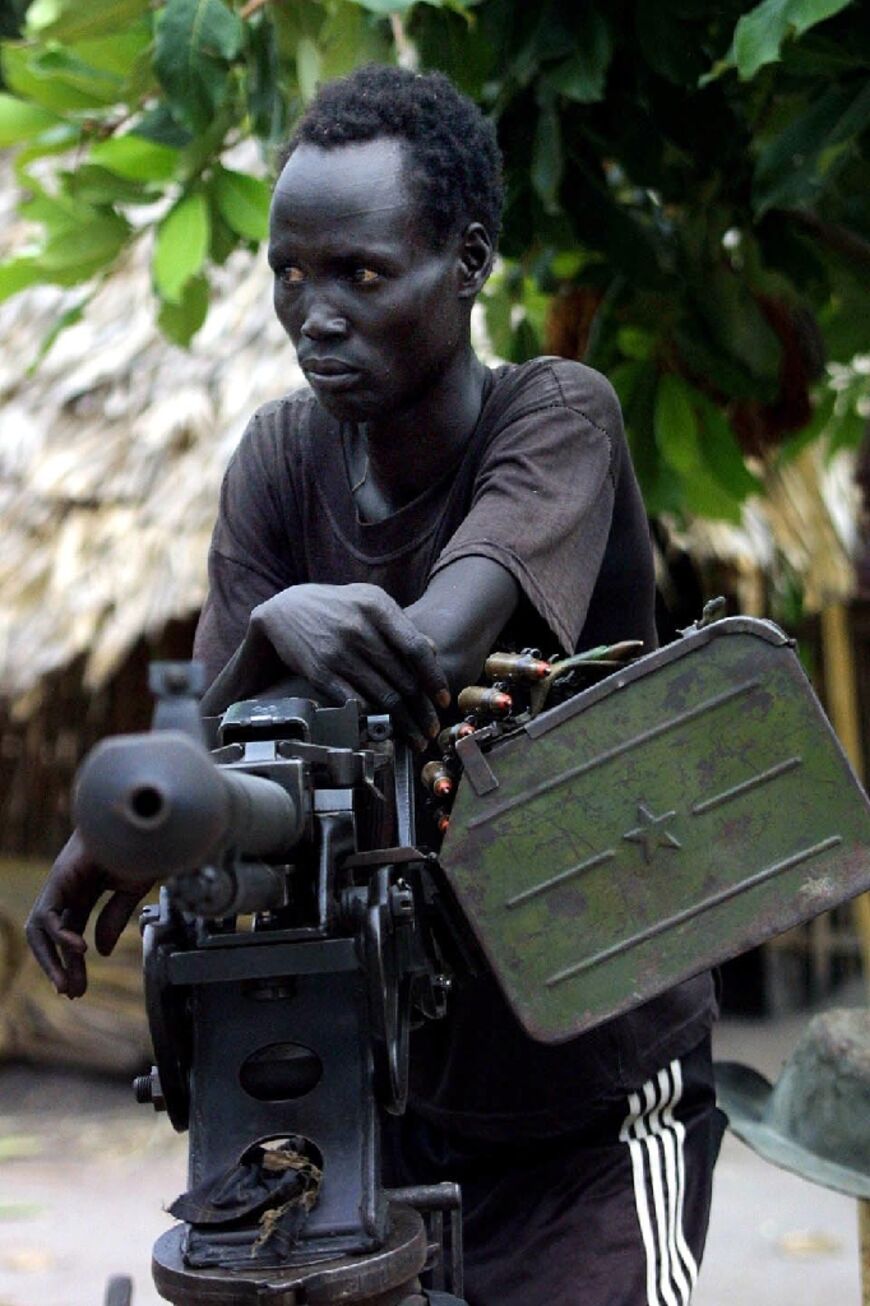 A Sudan People's Liberation Movement (SPLA) fighter in 2003, pictured in what is now the South Sudanese town of Rumbek, during the 1983-2005 Sudanese civil war