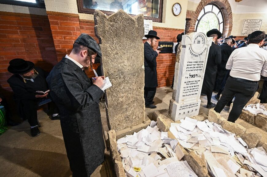 A young pilgrim writes his letter to 'Miracle Rabbi' Yeshaya Steiner