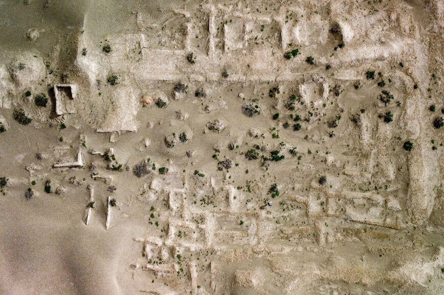 An aerial view of an ancient structure at the Umm al-Aqarib archaeological site, which is frequently buried by sandstorms due to desertification