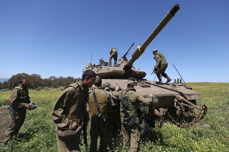 Israeli soldiers take part in a military exercise near Moshav Kidmat Tsvi in the Israeli-annexed Golan Heights on April 3, 2023