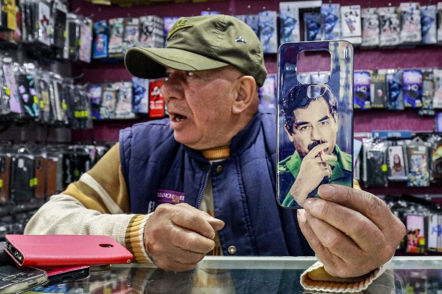 Saddam Hussein portraits are a popular choice for mobile phone covers at Shaher Abu Sharkh's accessories shop in the Jordanian capital Amman