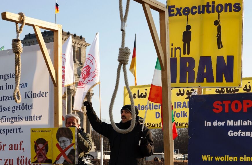 Two people, including protester Majidreza Rahnavard, were hanged in public, the report said