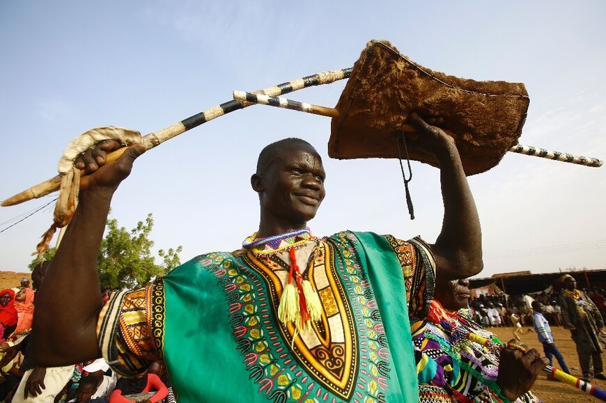 A member of Sudan's Nuba community performs a traditional dance in 2015: South Kordofan state's Nuba Mountains have suffered decades of conflict