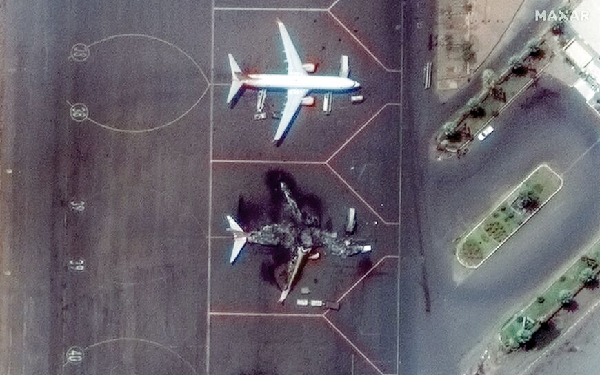 A satellite image taken on April 17, 2023 shows an Il-76 transport aircraft burned at Khartoum International Airport