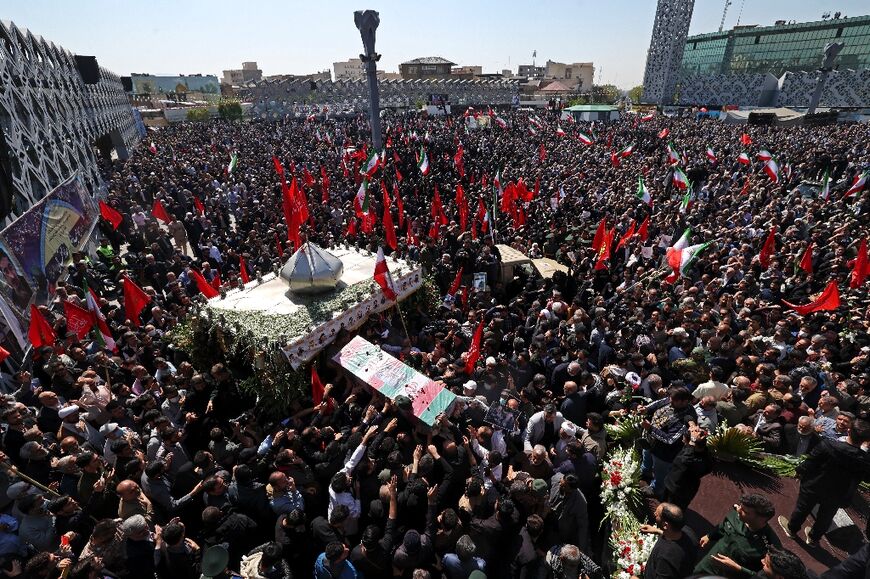 Thousands of Iranians on Tuesday attended a funeral procession in Tehran for two Revolutionary Guards killed in Israeli strikes in Syria last week