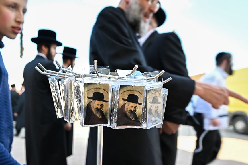 Rabbi Steiner memorial cards on sale in the village