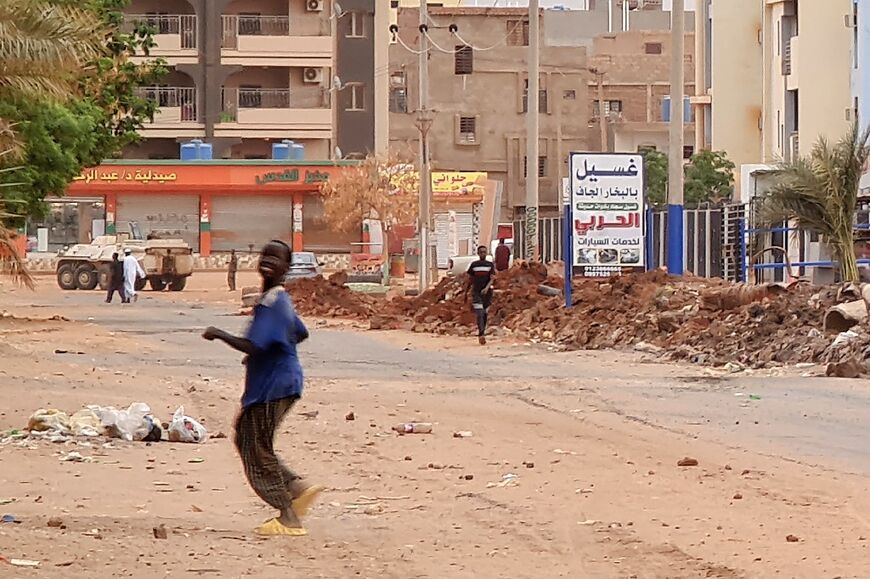 A Sudanese army armoured personnel carrier is parked near a trench in Khartoum as fighting continues