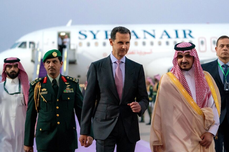 Saudi Arabia's Deputy Emir of Mecca Prince Badr bin Sultan bin Abdulaziz, on the right, received Syrian President Bashar al-Assad in Jeddah on the eve of the Arab League summit 