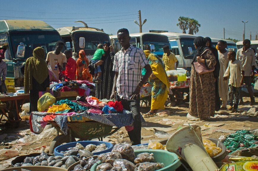 Street vendors in the Red Sea city of Port Sudan -- areas untouched by the fighting still suffer its effects, with soaring prices and fuel shortages