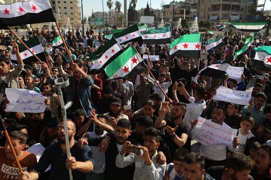 Syrians in the rebel-held northwestern city of Idlib protest in late April against the thaw in relations between Assad's government and several Arab countries