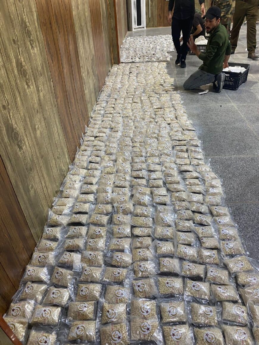 A picture released by the Iraqi border authority on March 11, 2023 shows captagon pills seized at the al-Qaim border crossing with Syria