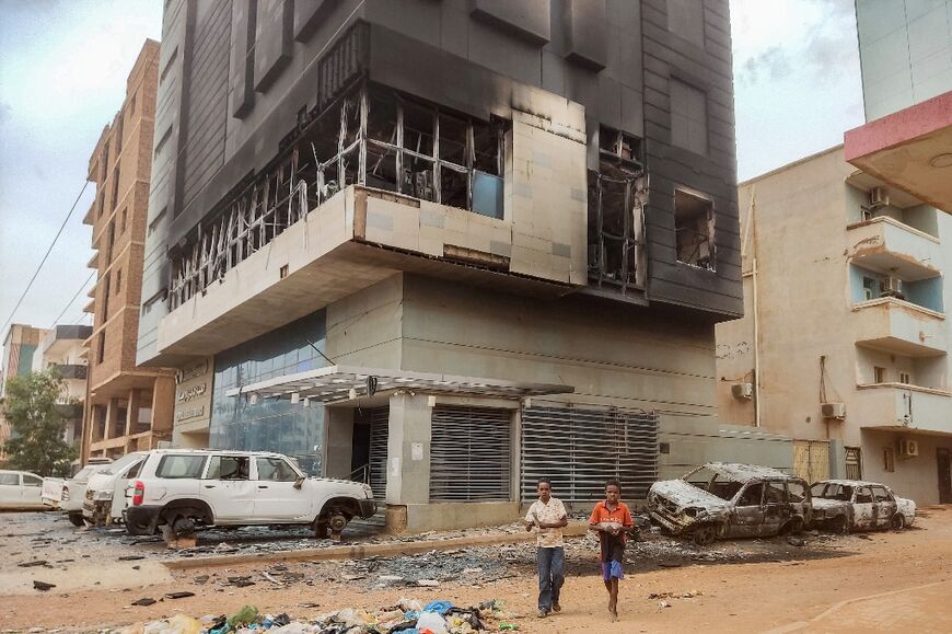 There has been widespread looting and arson of government offices and abandoned diplomatic missions in the Sudanese capital Khartoum