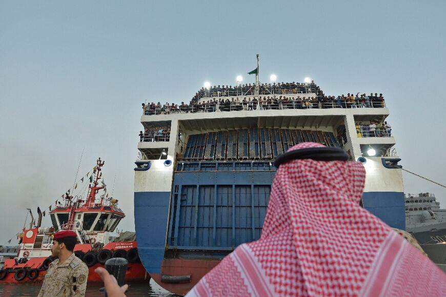 The Saudi-flagged ferry passenger ship Amanah carrying evacuated civilians fleeing violence in Sudan arrives at King Faisal navy base in Jeddah on April 26, 2023 