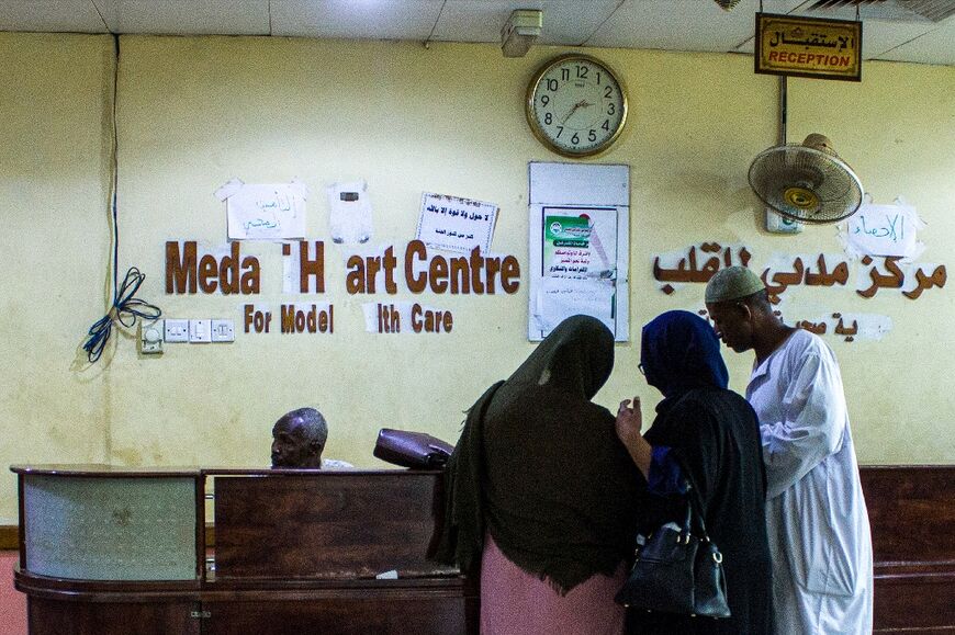 People at the reception desk of the Medani Heart Centre hospital in Wad Madani, the capital of the Al-Jazirah state in east-central Sudan, on May 25, 2023