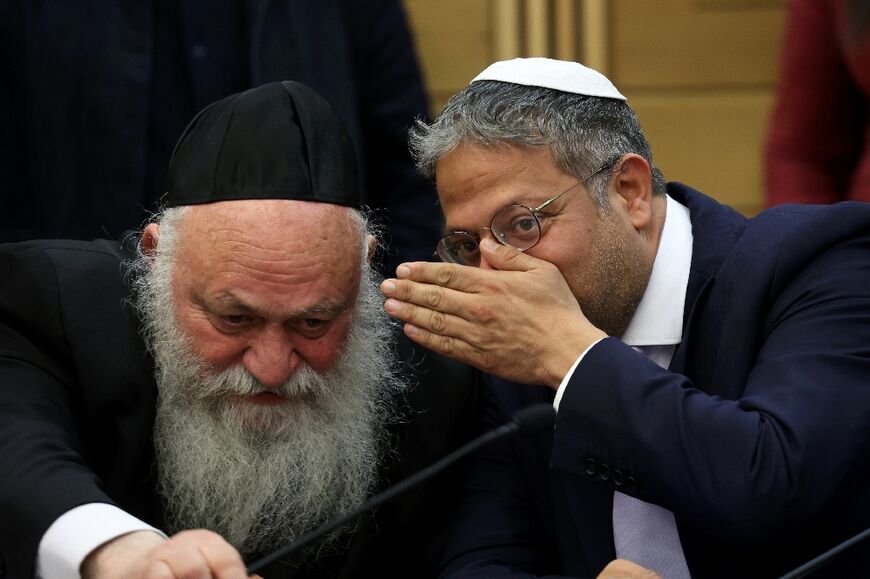 Israeli ministers Yitzchak Goldknopf (L) and Itamar Ben-Gvir speak during a media briefing ahead of the budget vote