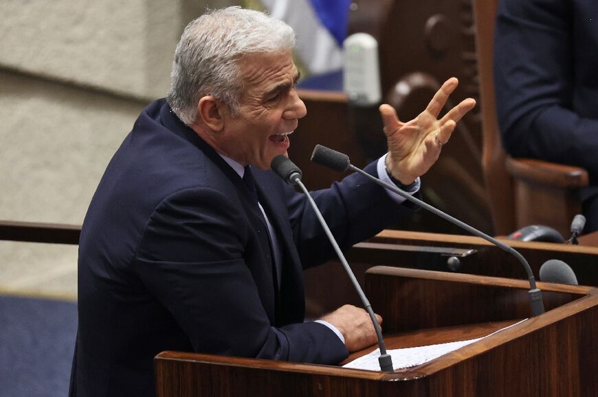 Israeli opposition head Yair Lapid delivers a speech during a parliament session to vote the national budget