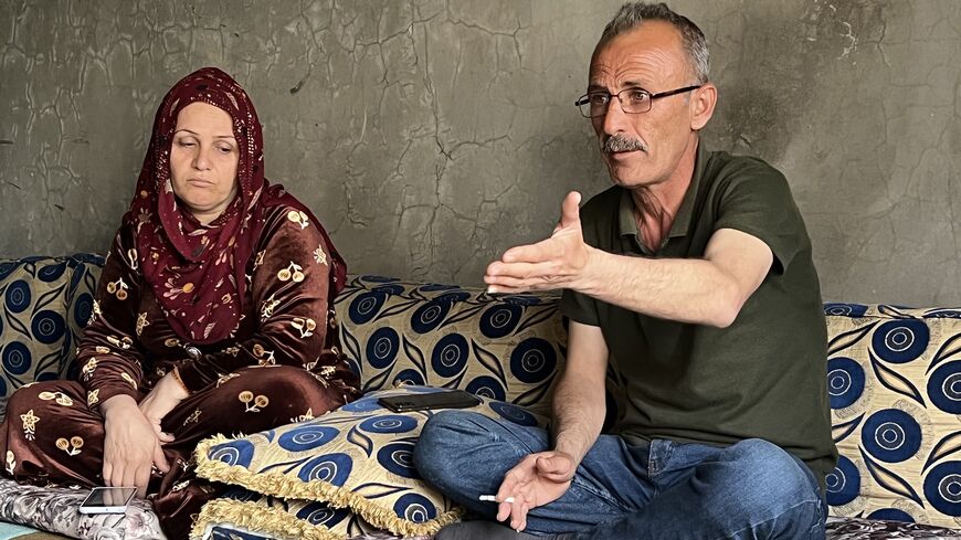 Ramziya and Azad Ramadan, whose 16 year old daughter Slava was killed in a Turkish drone strike on Aug. 18, 2022, seen at their family home in al-Darbasiyah on April 26, 2023. (photo by Amberin Zaman)