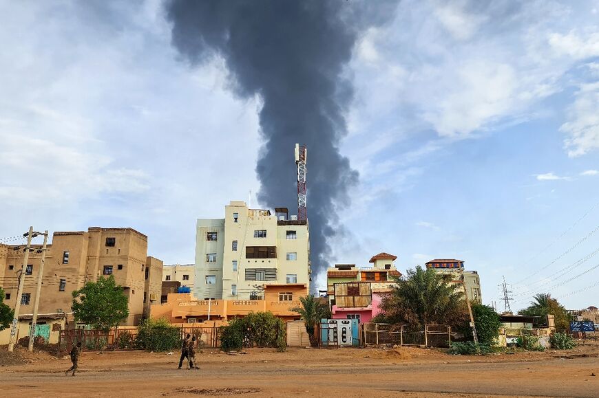 Smoke billows into the air over the Sudanese capital Khartoum as the fighting showed no let-up Friday