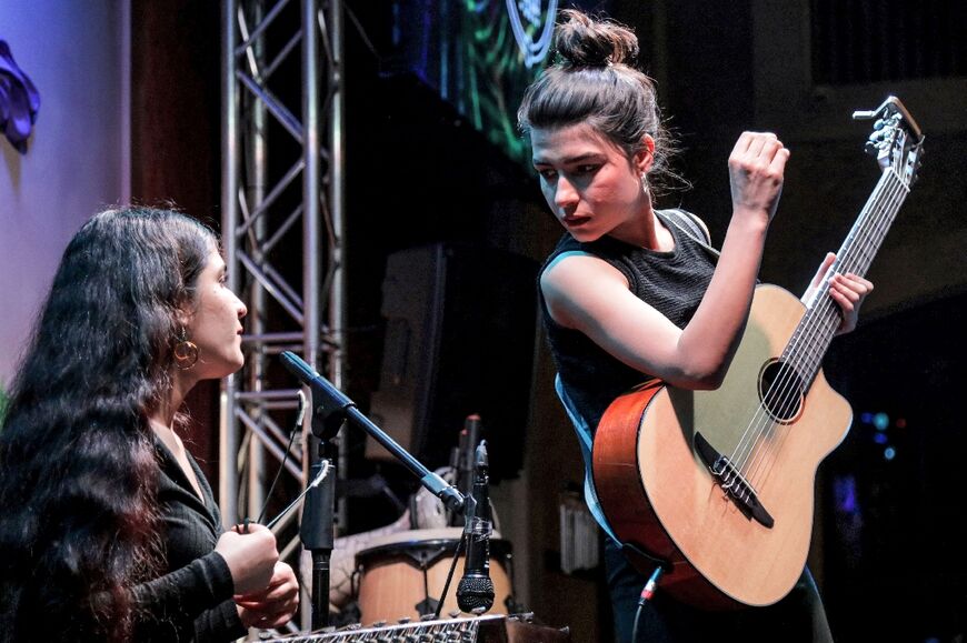 In their new home, sister duo Perwin and Norshean Salih carve out a living by performing the often melancholy Kurdish folk music