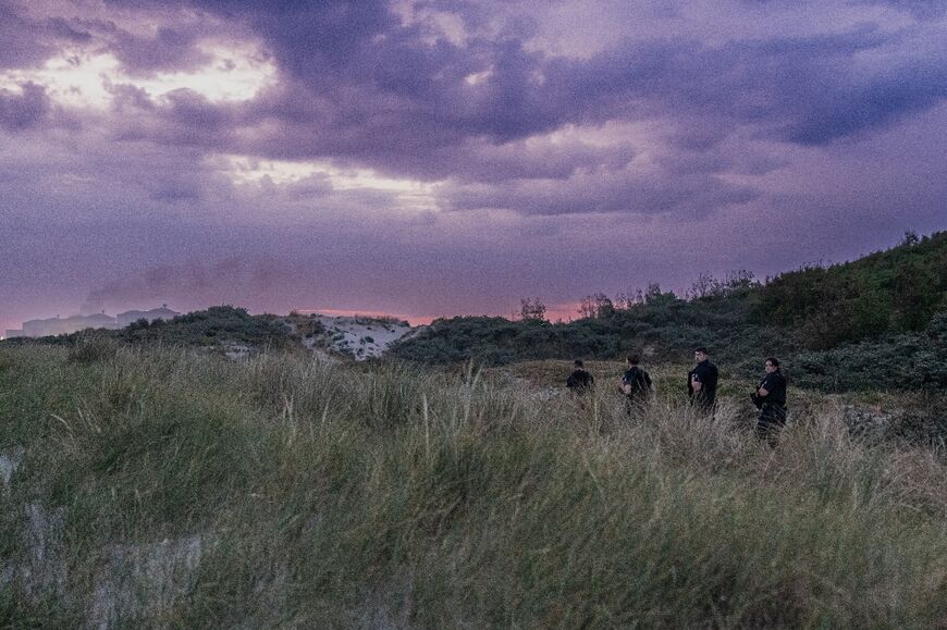 French Republican Security Corps (CRS)  search the dunes for migrants attempting to cross the English Channel 