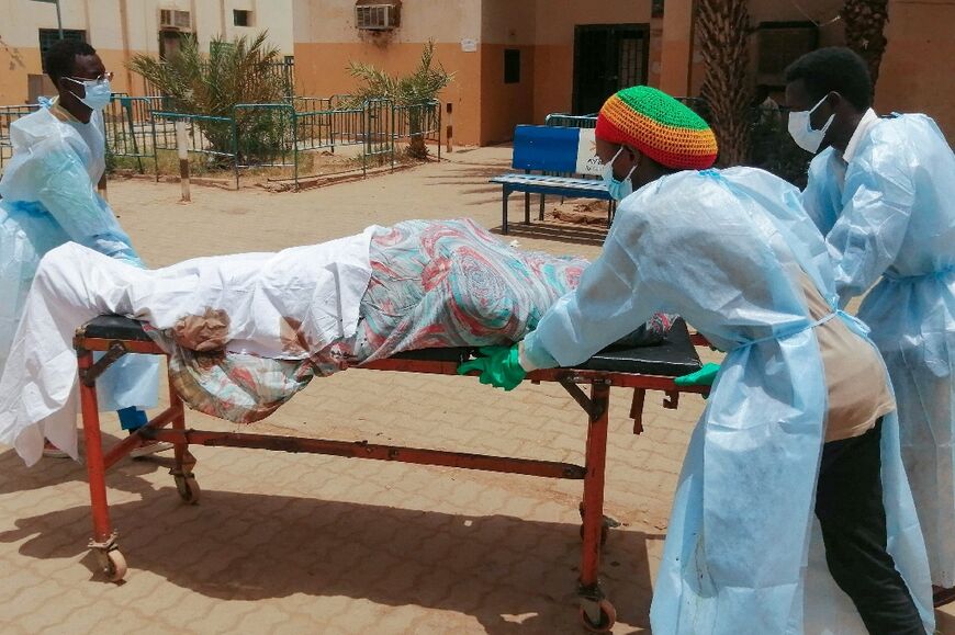 A body is transported to hospital in northern Khartoum -- Sudan's war has killed more than 2,000 people, according to the Armed Conflict Location and Event Data Project