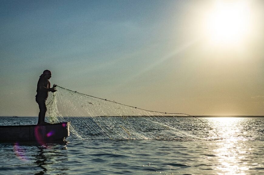 Fisherman Ali Shebli, 37, pulls his net from Lake Assad, Syria's biggest freshwater reservoir